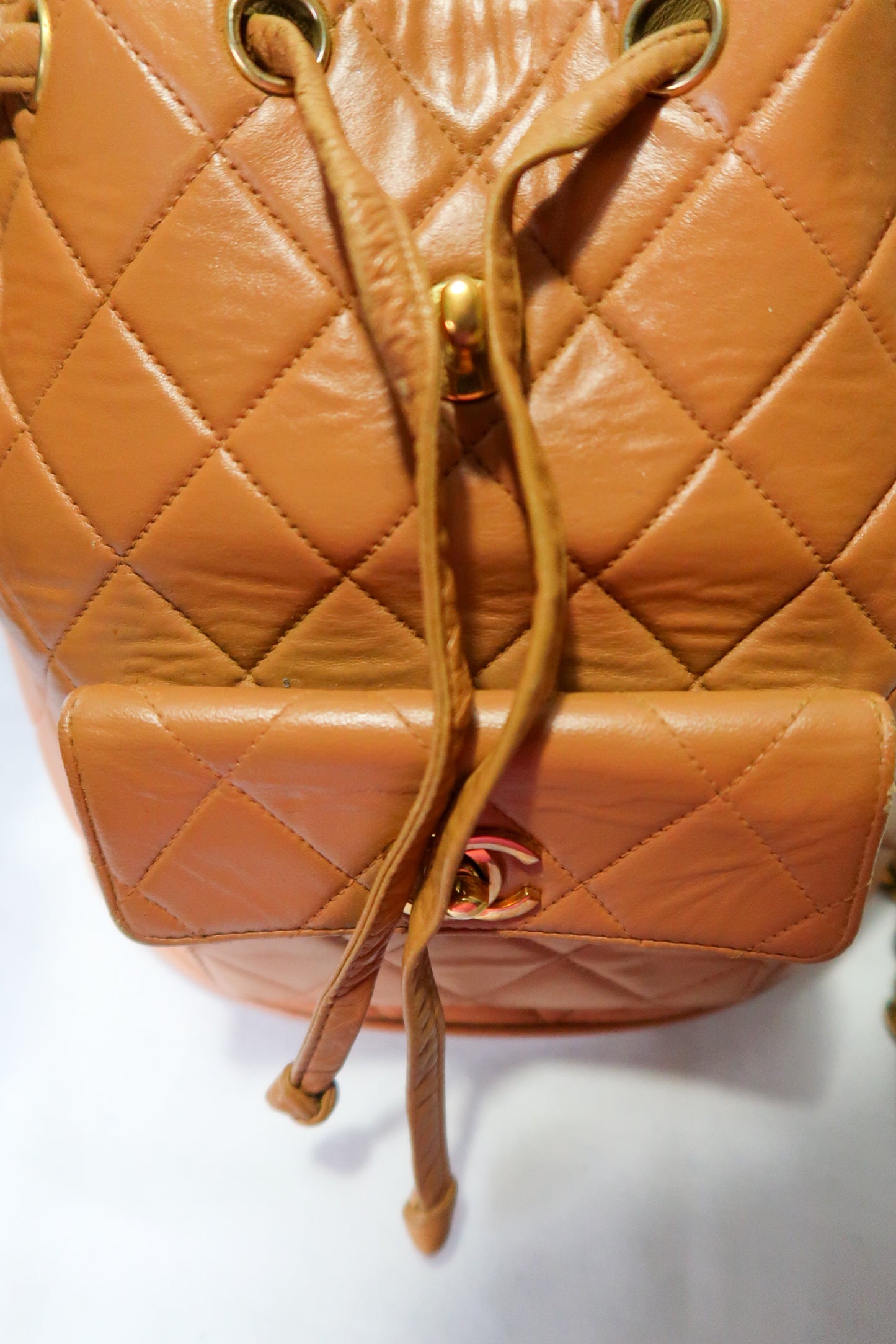 Chanel Lambskin Quilted Drawstring Backpack Camel