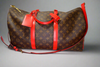 Louis Vuitton Keepall Bandoulière 50 – Monogram Canvas with Red Leather Trim