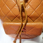 Chanel Lambskin Quilted Drawstring Backpack Camel