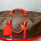 Louis Vuitton Keepall Bandoulière 50 – Monogram Canvas with Red Leather Trim