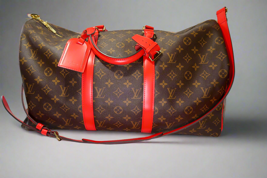 Louis Vuitton Keepall Bandoulière 50 – Monogram Canvas with Red Leather Trim